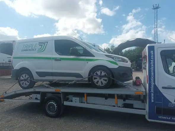 Ford Transit van loaded onto recovery flatbed — commercial van recovery by IM Logistics