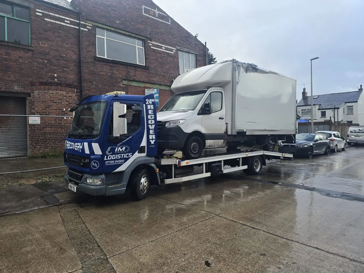IM Logistics 7.5-tonne DAF recovery truck carrying a box van — heavy vehicle recovery
