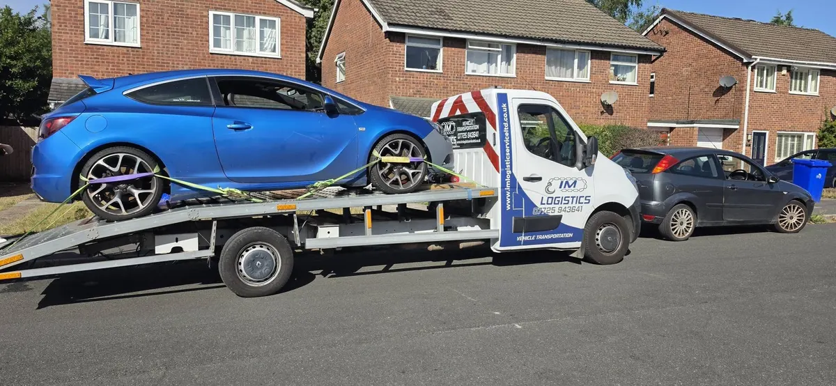 Blue Vauxhall Astra GTC on IM Logistics recovery truck — fast car recovery service
